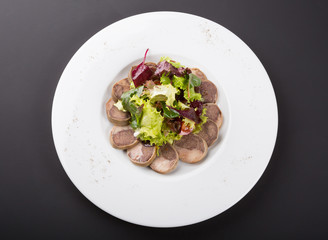 Sliced homemdae sausage on a plate