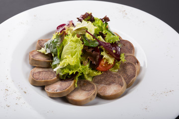 Sliced homemdae sausage on a plate