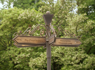 signpost direction indicator pointer sign guidance street park path