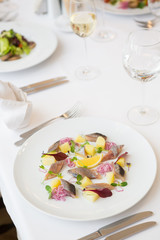 Salted herring fillet slices served with onion
