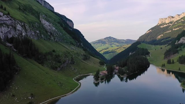 Aerial pan over the Seealpsee lake in the Appenzell Alps, Switzerland