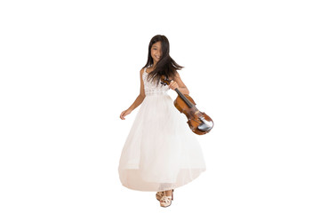 A portrait of a cute, elementary school Asian girl with long hair and wearing a white evening dress holding her violin. An isolated image with white background