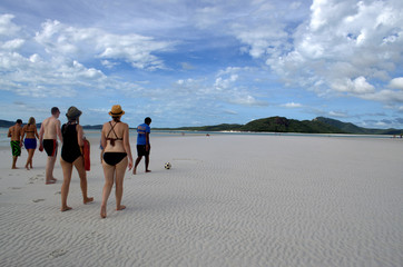 Group of tourist walking at Whitehaven Beach, Australia.