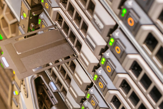 Front panel of the network router. Array of database servers with many hard drives. Space for text at service tag. computer equipment works in the server room of the data center.