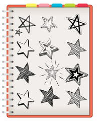 Open notebook with star drawing