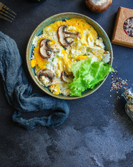 scramble fried eggs
omelet mushroom concept healthy eating. food background top view copy space for text keto or paleo