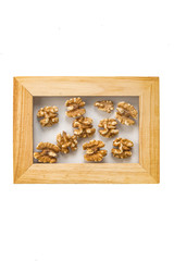 walnut nuts in a photo frame isolate on a white background