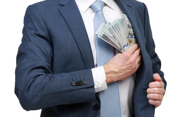 Businessman placing money into his pocket