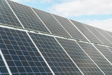 Solar panels on the blue sky background. Concept of green energy, clean energy, renewable energy