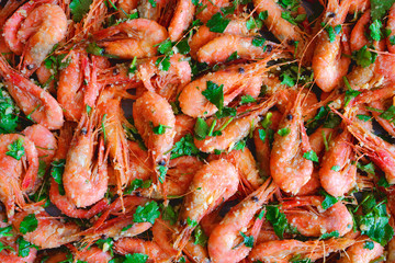 Fresh boiled prawns with coriander. A delicious dish of seafood.