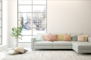 White living room with sofa and winter landscape in window. Scandinavian interior design. 3D illustration