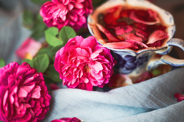 Selective focus old vintage ceramic cup of tea with flowers. Elegance and romantic table ware.