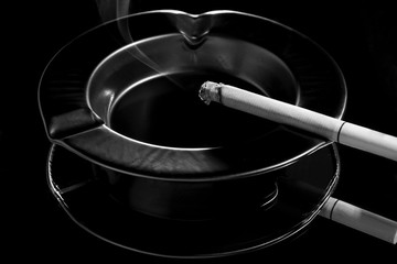 Black and white ashtray and cigarette