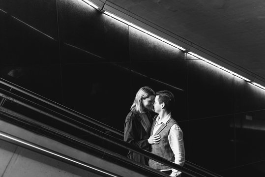 Beautiful Woman And Man Hug And Kiss On The Subway.