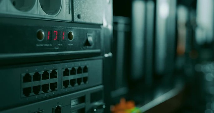 Blinking 101 red lights on a switch in a datacenter or network room rack indicating that a reset has been made or a new set up has been added to the network