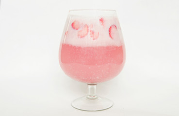 Strawberry cocktail in glass on white background