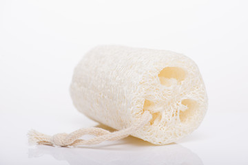 Zero waste concept. Close-up photo of luffa sponge isolated on white background