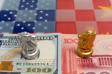 Chess pieces on USA and China national flag with banknote background