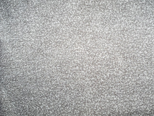 Light gray background with white specks. Background from gray matter