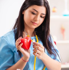 Young beautiful female doctor working in the clinic