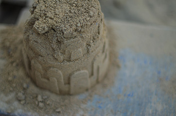 sand house made by the sandbox on a warm summer day