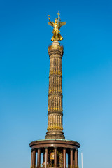 Fototapeta na wymiar Golden satue and berlin Victory Column, a monument to commemorate the Prussian victory in the Danish-Prussian War and defeated Austria and Austro-Prussian War & France