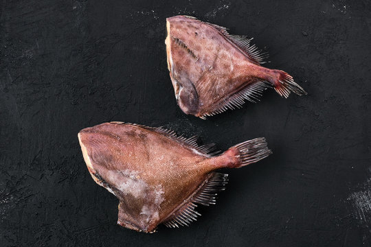 Raw crimson sea bream on black background