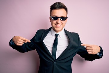 Young handsome caucasian business man wearing funny thug life glasses looking confident with smile...