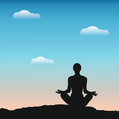 silhouette of a young woman meditating