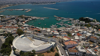 Aerial drone photo of famous ancient style theater of Veakio above round port of Mikrolimano and...