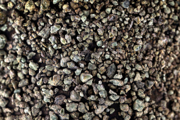 Ground stone, grey background with many small stones. Rock texture background, macro photography