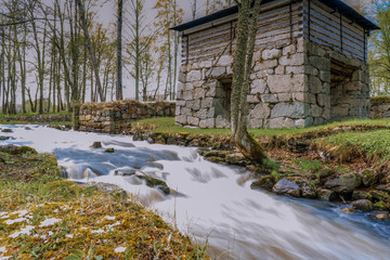 Fototapeta na wymiar The stream in the spring. Photo of scandinavian nature.
