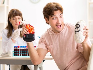 Man giving his blood as a donor