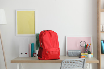school backpack and stationery in a bright room. Preparing for school. Back to school. Place for...