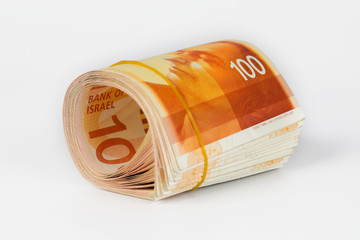 Bunch of 100 Israeli New Shekels (NIS) bills rolled together with a rubber band.