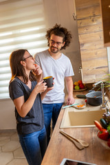 Couple having fun in the kitchen