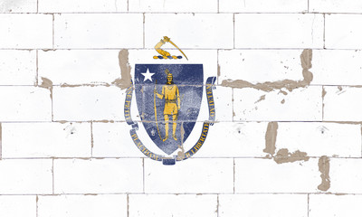 The national flag of the US state of Massachusetts with a blue coat of arms and a yellow saber at...