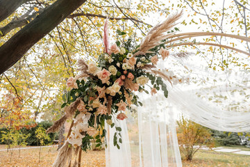 Round wedding arch decorated with flowers