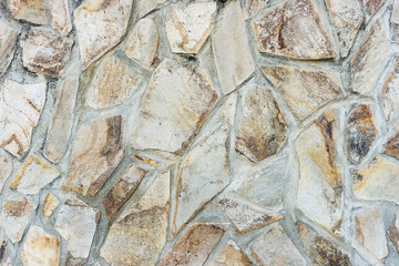 Light sandstone wall. Wall asymmetric texture.