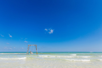 Young woman on swing Phu Quoc
