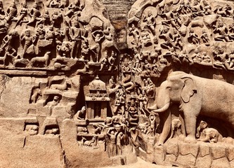 Descent of the ganges: A giant open air rock cut bas relief sculptures carved on two monolithic rocks in Mahabalipuram, Tamil nadu. It contains sculptures of animals, God, People and half-humans.