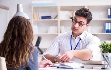 Sales assistant discussing transaction with customer