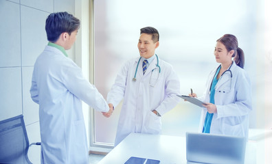 Doctor shake hand success trust in teamwork medical healthcare and insurance concept