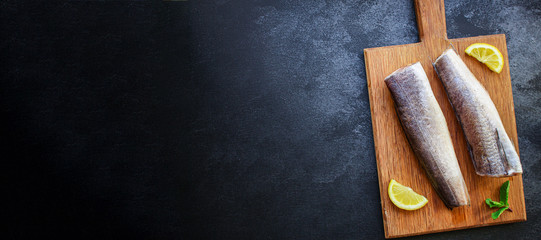 fish raw hake (set of ingredients). food background. top view. copy space ketogen or paleo diet pascarian