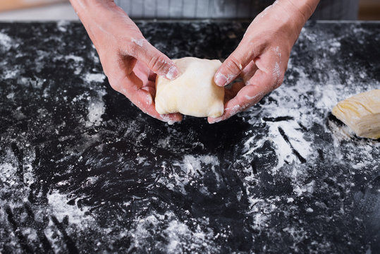 Female Hands Folding Meat Stuffed Raw Puff Pastry