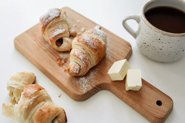 Homemade croissants on the table with a cup of cocoa. view from above - 352601549