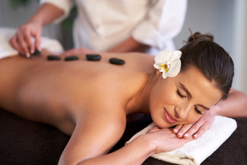 Fototapeta na wymiar Relaxed woman receiving back massage