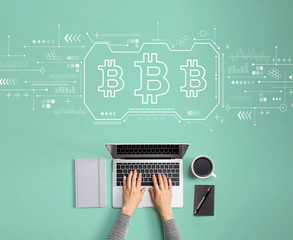 Bitcoin theme with person using a laptop