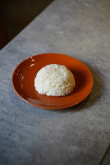Stream rice on orange plate, stream rice on background