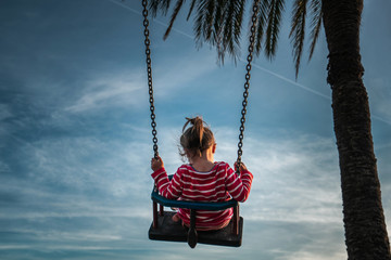 little girl on swing